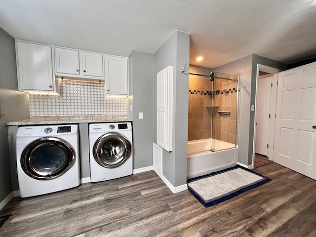 laundry room featuring separate washer and dryer and dark hardwood / wood-style flooring