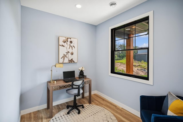 office area featuring baseboards and wood finished floors