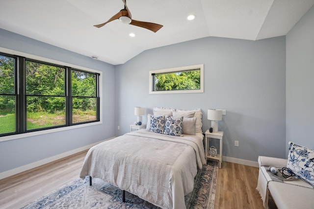 bedroom with lofted ceiling, wood finished floors, recessed lighting, ceiling fan, and baseboards