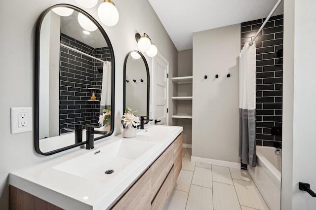 full bath with a sink, double vanity, baseboards, and shower / bathtub combination with curtain