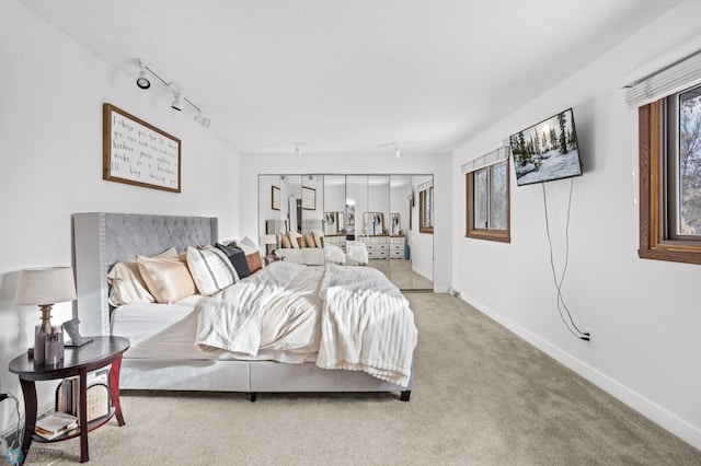 bedroom featuring light colored carpet