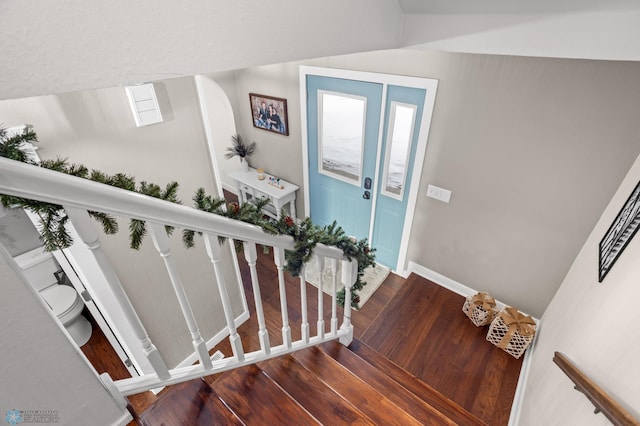 stairway with wood-type flooring