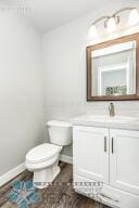 bathroom with vanity and toilet