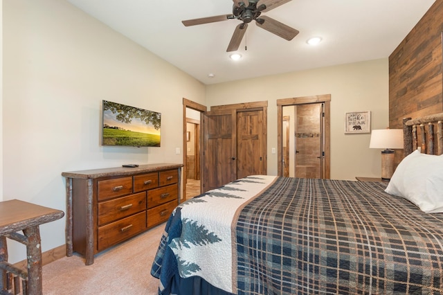 bedroom featuring ceiling fan and light carpet