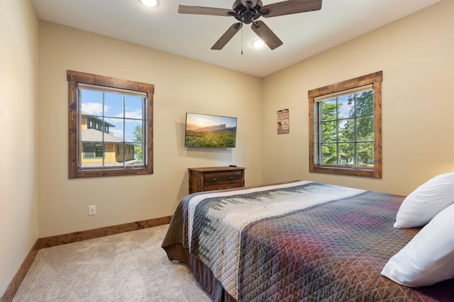 bedroom with ceiling fan and carpet floors