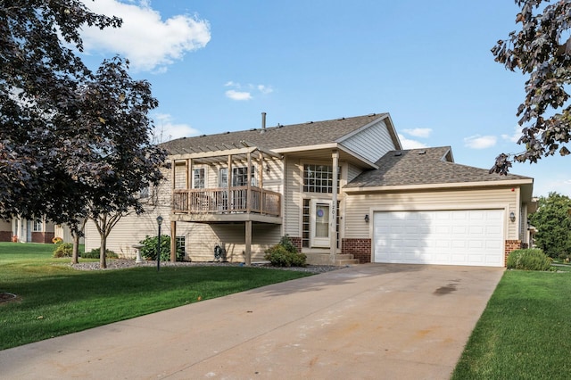 view of front of property with a front lawn and a garage