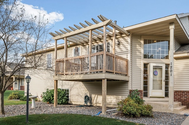 rear view of house with a balcony and a pergola