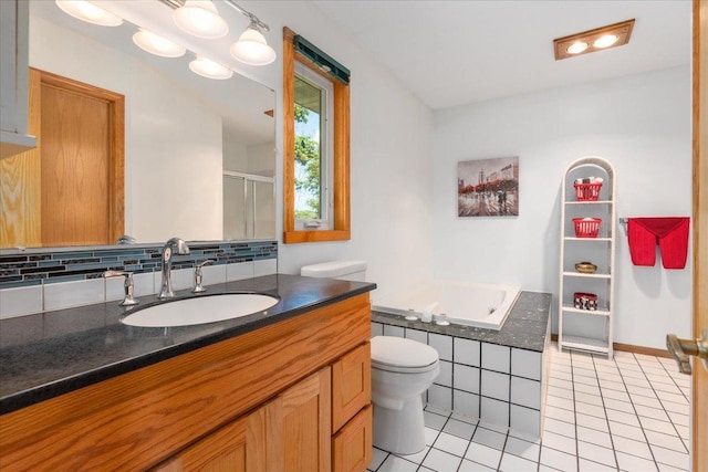 full bathroom with toilet, vanity, plus walk in shower, tile patterned flooring, and backsplash