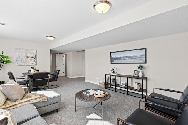 living room featuring a textured ceiling and carpet