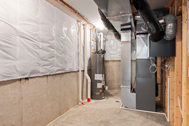 utility room featuring gas water heater