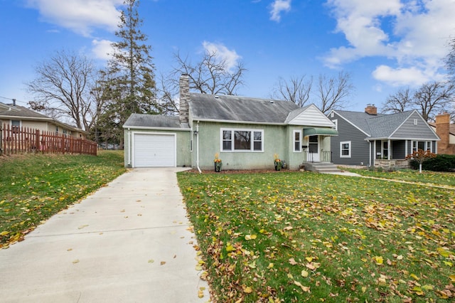 view of front facade featuring a front yard and a garage