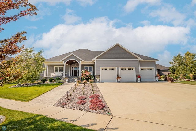 craftsman house featuring a garage, covered porch, and a front lawn