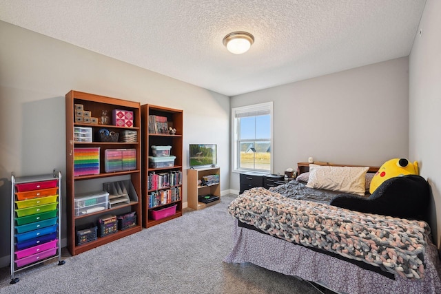 carpeted bedroom with a textured ceiling