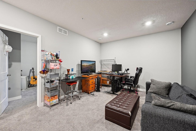 office area featuring carpet floors and a textured ceiling