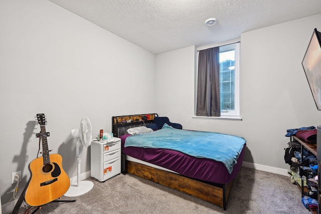 carpeted bedroom with a textured ceiling