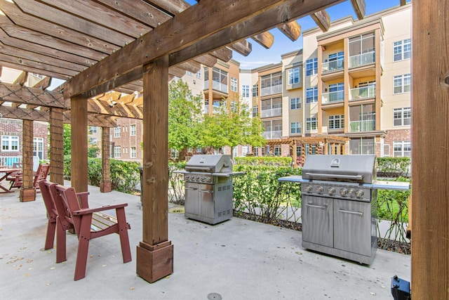 view of patio featuring a pergola and grilling area