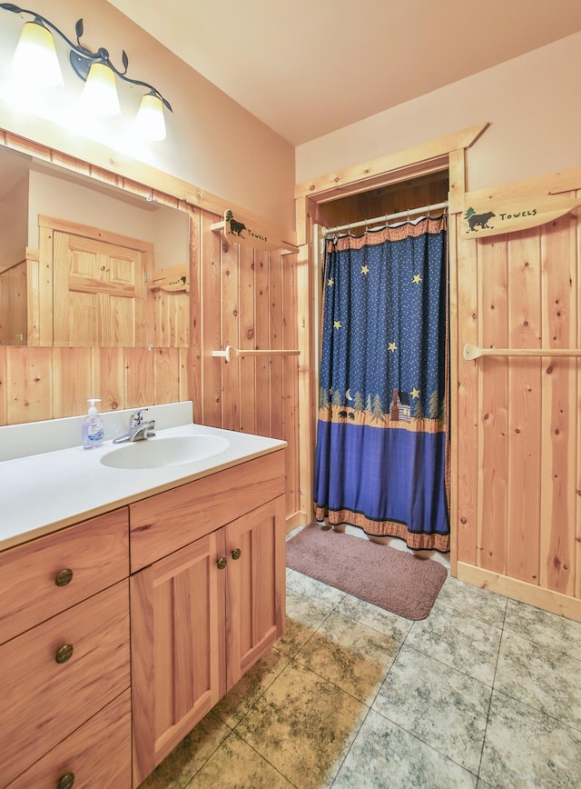 bathroom with curtained shower and vanity