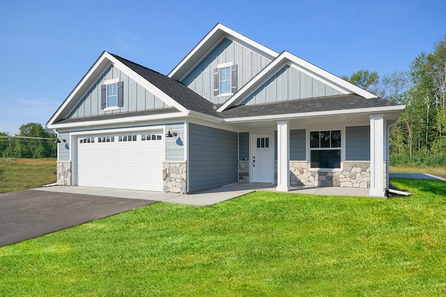 craftsman-style house with covered porch and a front yard