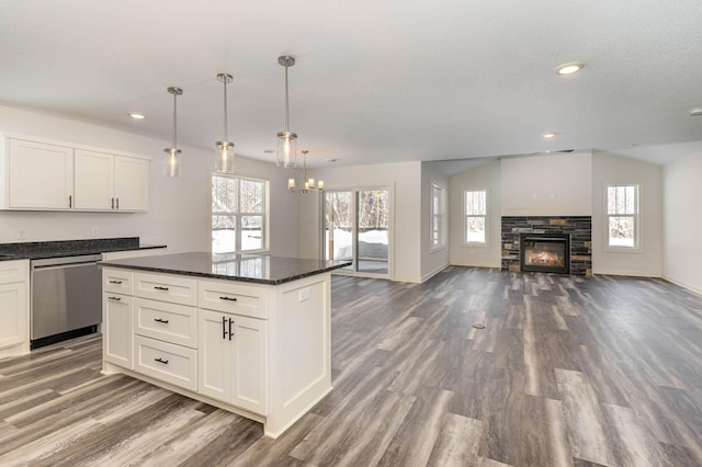 kitchen with pendant lighting, a wealth of natural light, white cabinetry, and dishwasher