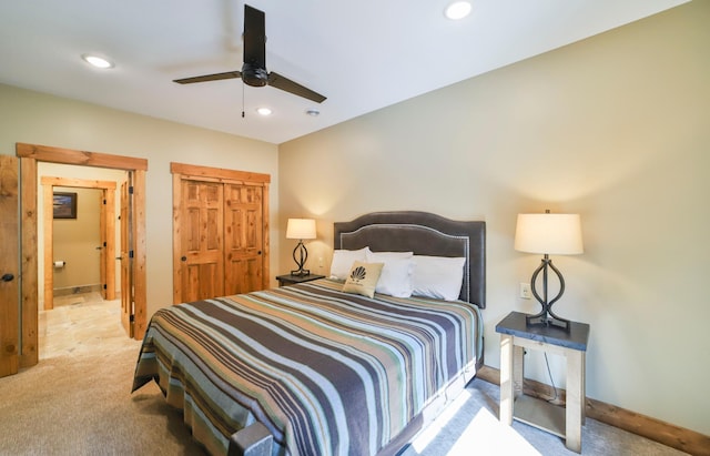 bedroom featuring light colored carpet and ceiling fan