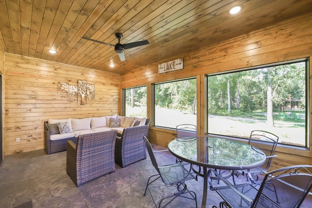 interior space with wooden walls, wood ceiling, a ceiling fan, and recessed lighting