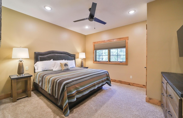 bedroom featuring light carpet, baseboards, a ceiling fan, and recessed lighting