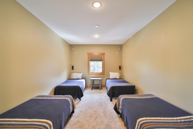 bedroom featuring light colored carpet