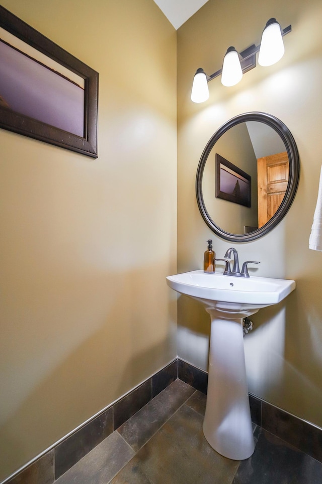 bathroom with tile patterned floors