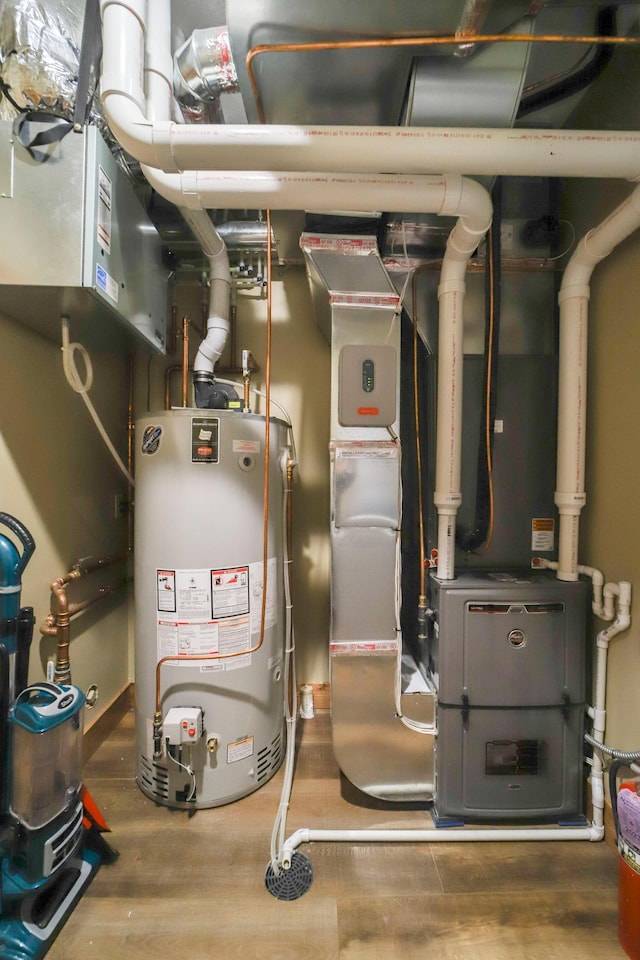 utility room with gas water heater