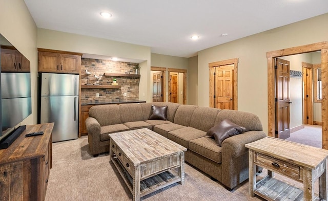 living area featuring light colored carpet and recessed lighting