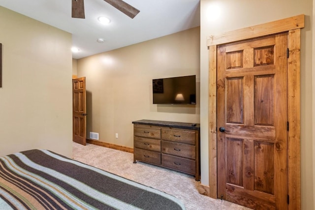 bedroom featuring baseboards, ceiling fan, carpet flooring, and visible vents