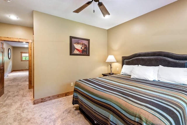 bedroom featuring light carpet and ceiling fan