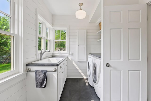 20390 Linwood Rd, Deephaven, MN 55331 - laundry room with separate washer and dryer, cabinet space, dark tile patterned flooring, and wood walls
