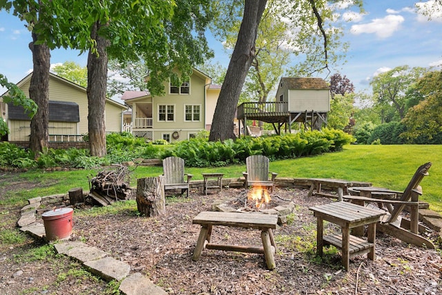 20390 Linwood Rd, Deephaven, MN 55331 - view of green lawn with an outdoor fire pit