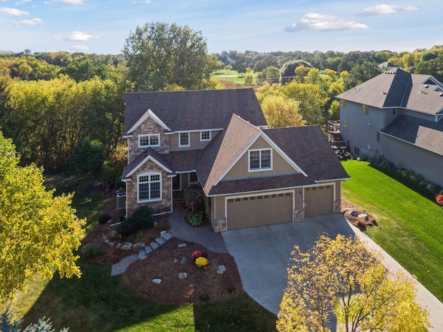 view of front facade featuring a garage and a front lawn