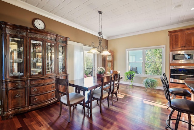 dining room featuring ornamental molding, dark hardwood / wood-style flooring, and a wealth of natural light