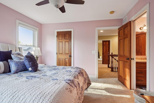 bedroom featuring light carpet and ceiling fan