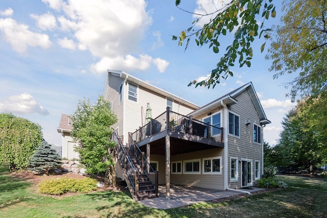 back of house with a yard, a patio, and a deck