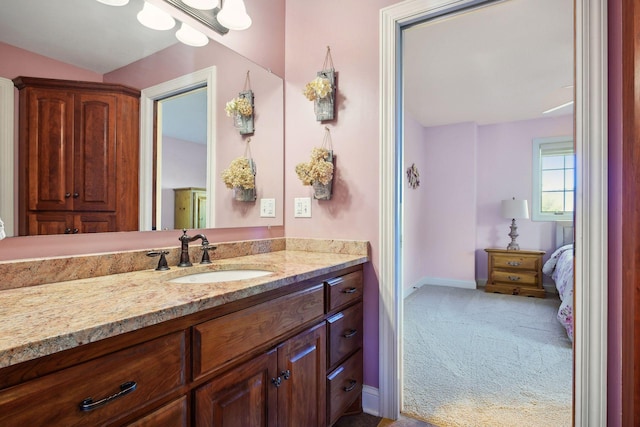 bathroom featuring vanity and baseboards