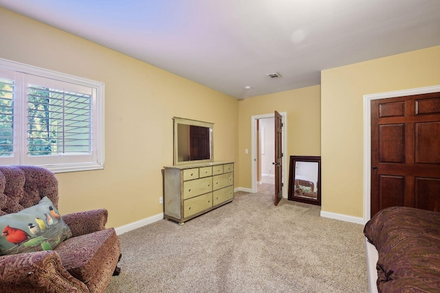 interior space with light colored carpet, visible vents, and baseboards