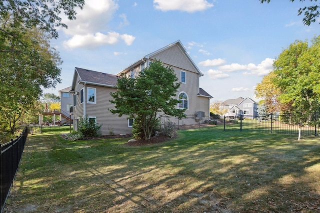 exterior space featuring a yard and a fenced backyard