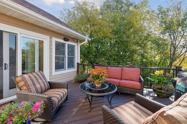 wooden terrace featuring an outdoor hangout area