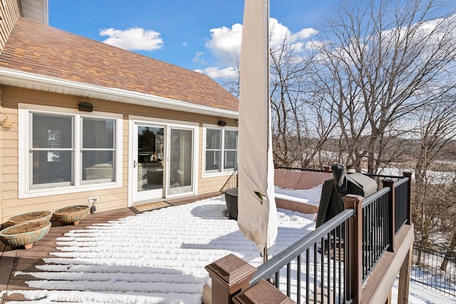 view of snow covered deck