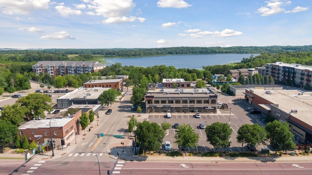 bird's eye view featuring a view of trees and a water view