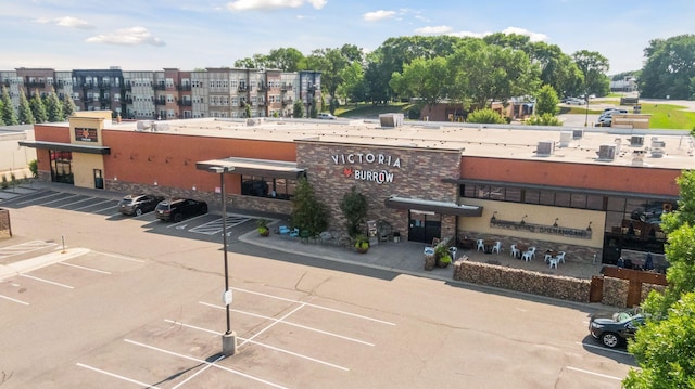 view of building exterior featuring uncovered parking