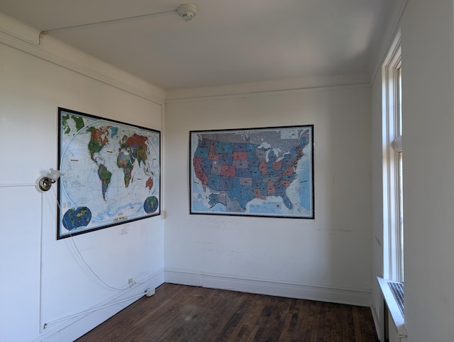 unfurnished room featuring dark hardwood / wood-style floors