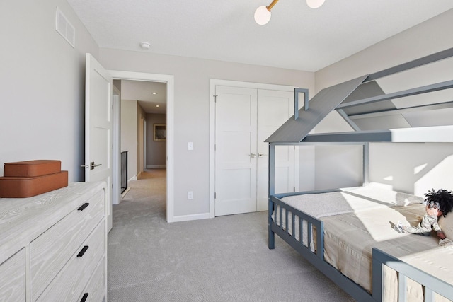 bedroom featuring a closet and carpet