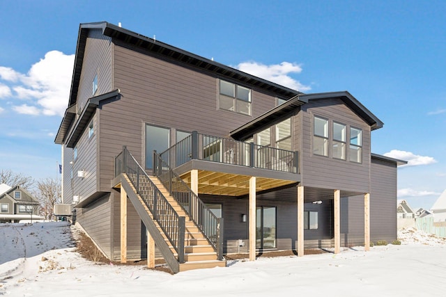 snow covered house with a balcony