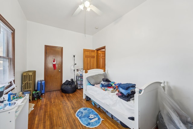 bedroom featuring wood-type flooring and ceiling fan