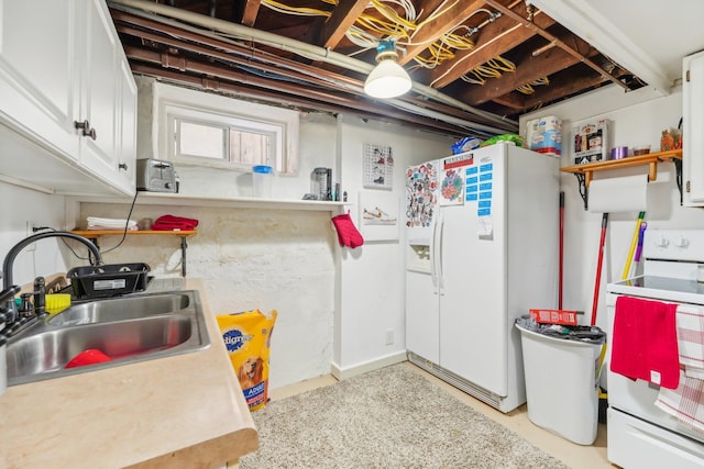 kitchen featuring white cabinets, white appliances, and sink